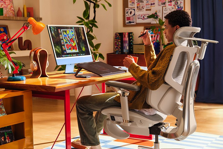 artist stting in HBADA desk office CHAIR thinking