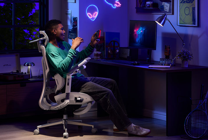 Person happily sitting in a HBADA ergo gaming chair