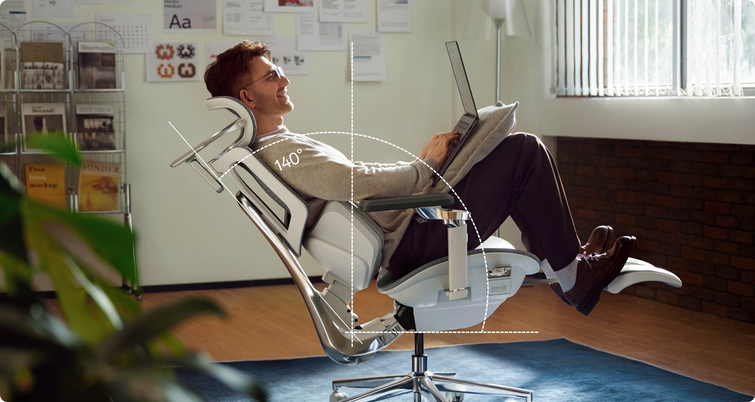 Person using a laptop sitting in Hbada X7 ergonomic office chiar